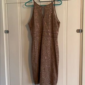 Lined, sequined knee-length dress.